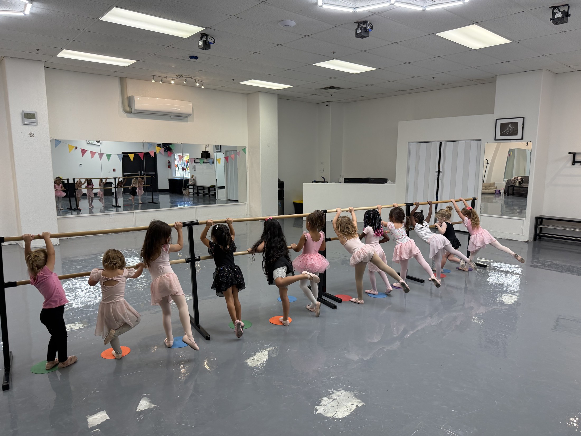 Young dancers gathered in the studio for class