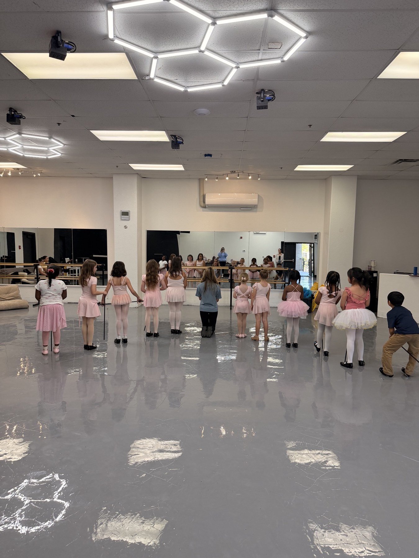 Arise dancers practicing jazz movement